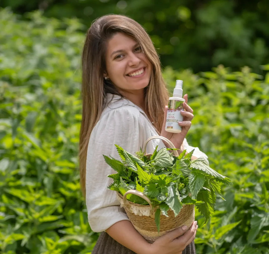 smiling woman with nettles